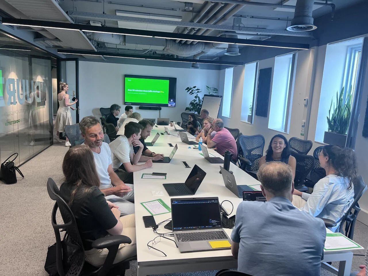 KPN workshop participants experimenting with AI together around a table