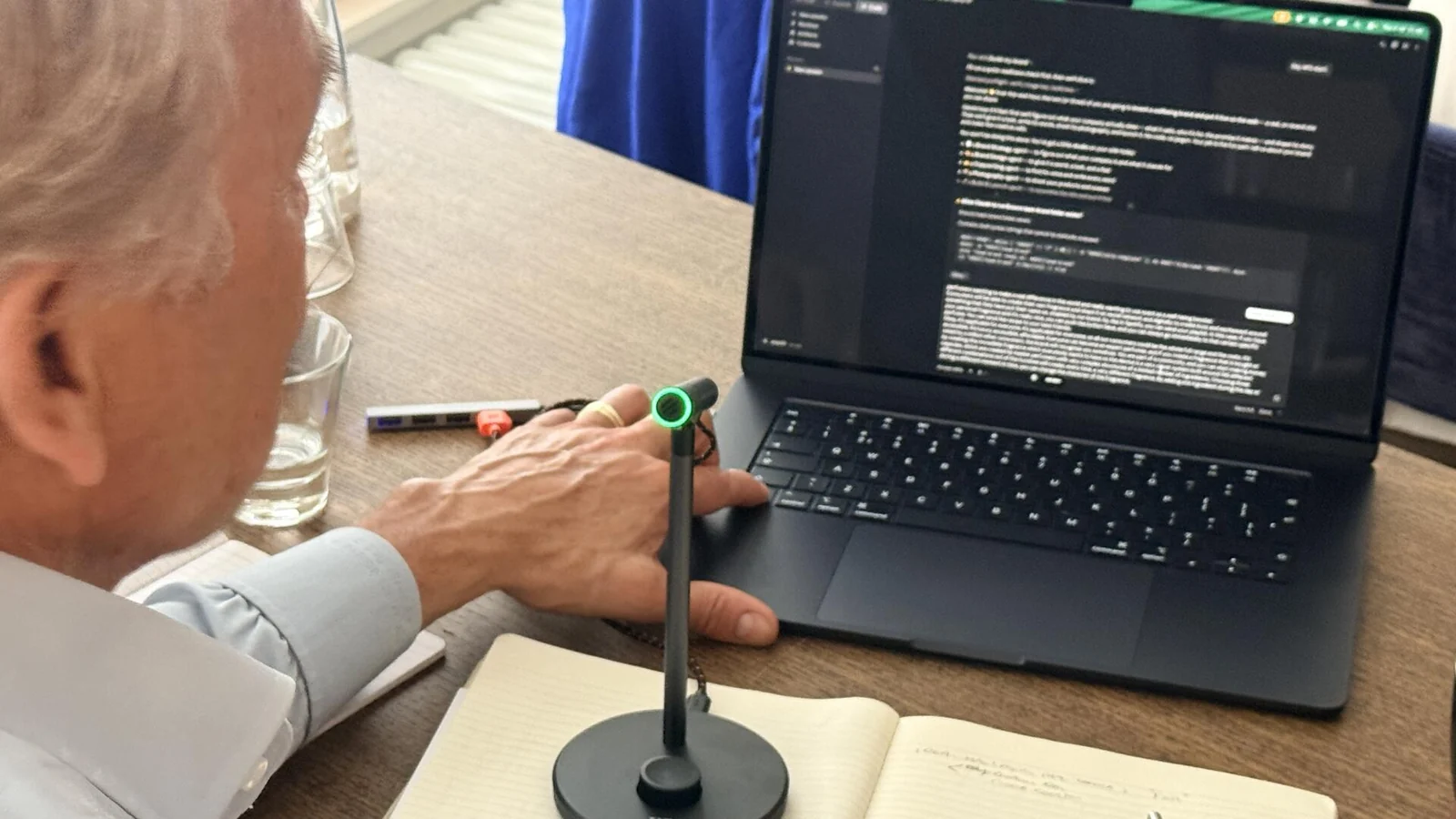 Rituals workshop participant trying an AI tool on a laptop